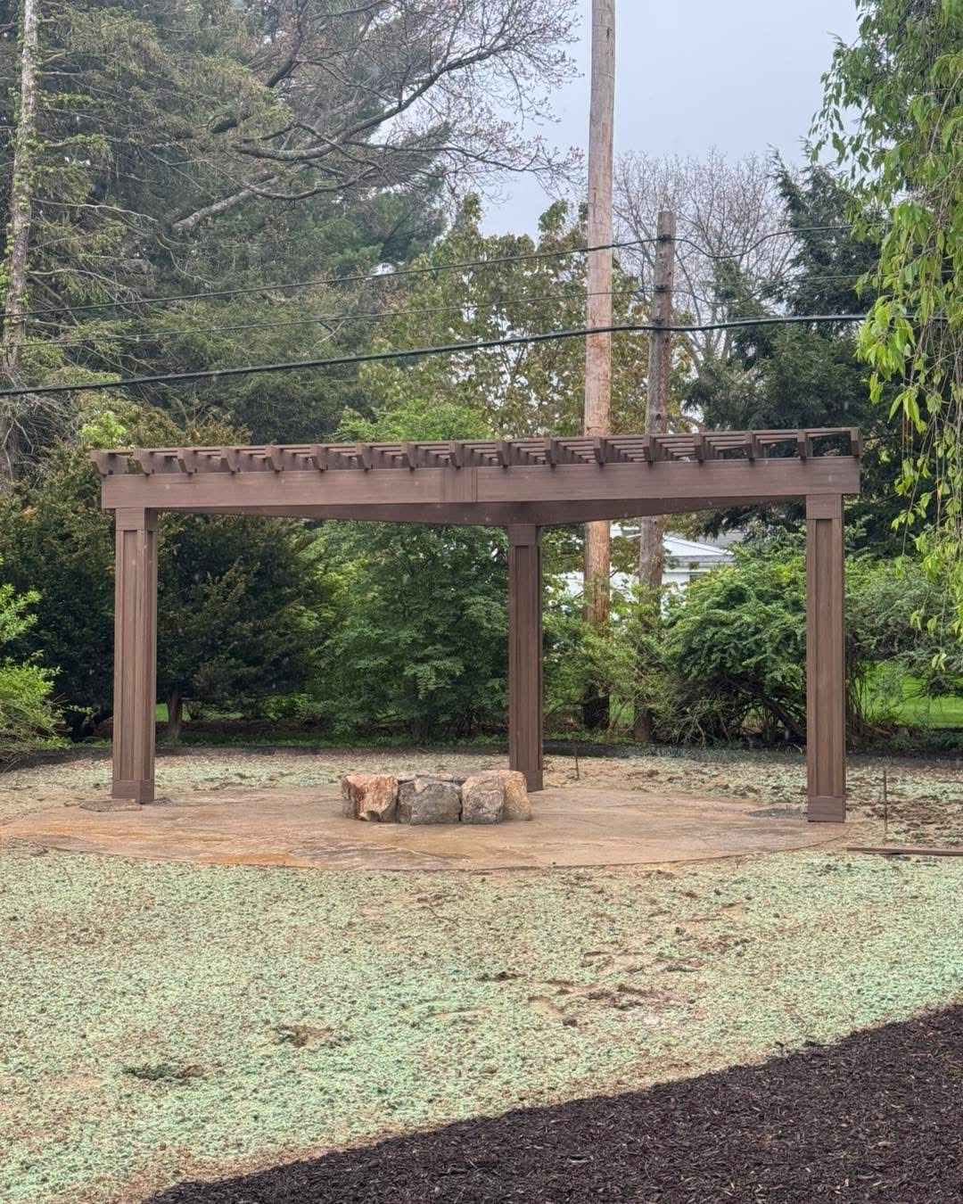 Outdoor pergola structure in a yard